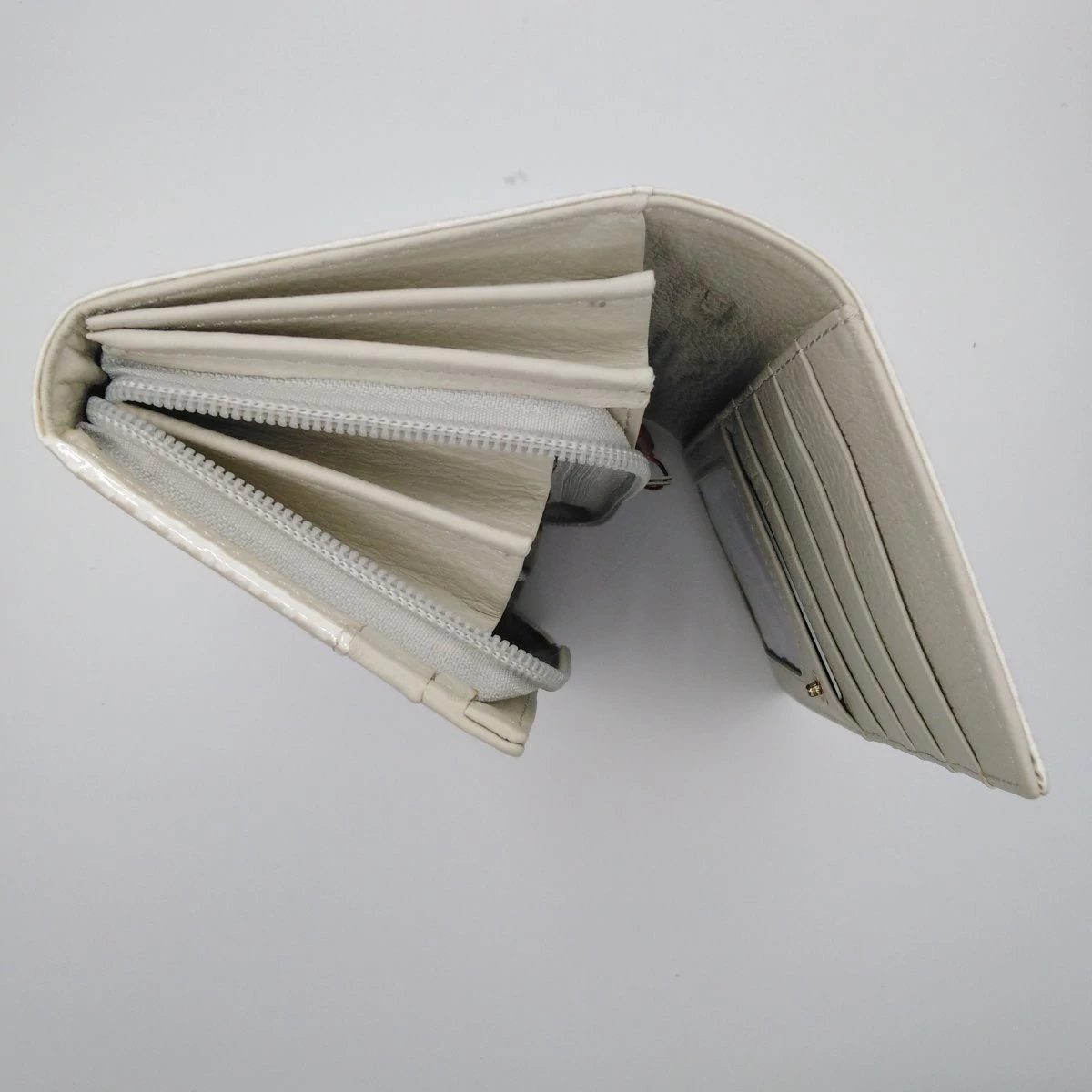 42106 Peterson pénztárca cippes brifkó beige